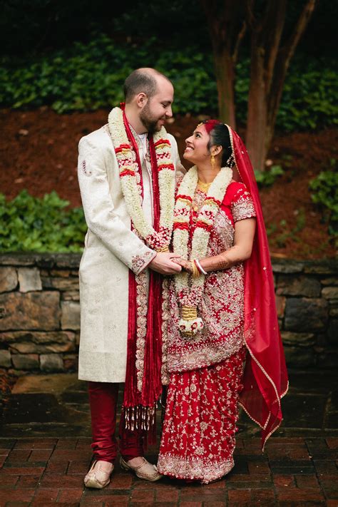 Bride and Groom in Red Traditional Indian Wedding Attire