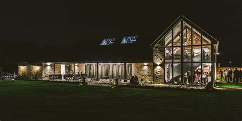 This Cotswolds barn wedding venue looks stunning at night - Blackwell Grange Weddings