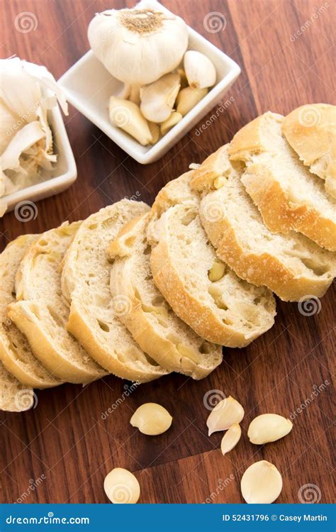 Fresh Baked Loaf of Bread with Whole Cloves of Roasted Garlic Stock ...