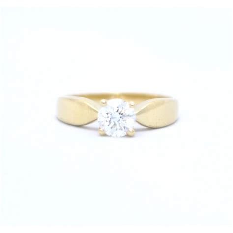 diamond solitaire ring set in 18ct yellow gold