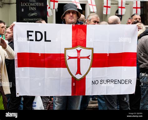 An English Defence League Supporter holds up and English Flag Stock Photo - Alamy