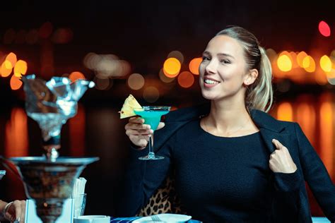 A Woman Holding a Cocktail Drink · Free Stock Photo