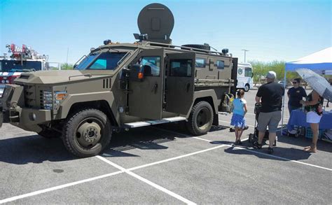 A family checks out a SWAT truck at the 2019 Spring - NARA & DVIDS Public Domain Archive Public ...