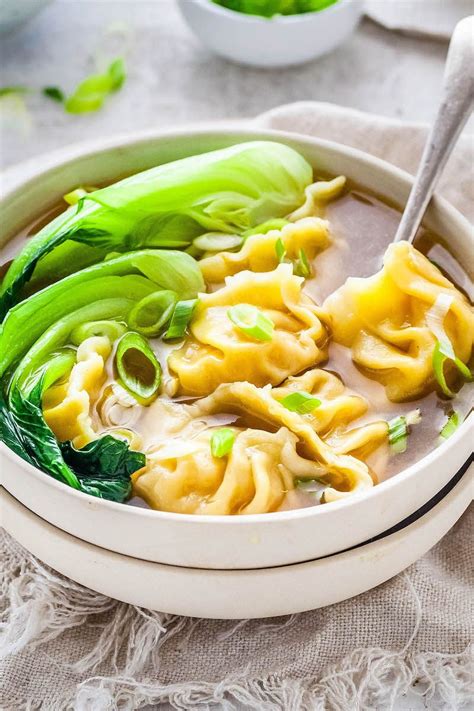 This Wonton Soup recipe is epically delicious with all the many layers of flavor and juicy ...