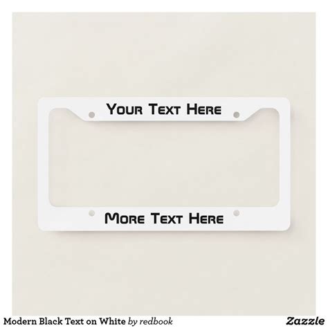 a white license plate frame with your text here on the front and back side,