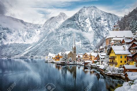 94927268-the-snow-covered-village-of-hallstatt-in-the-austrian-alps ...