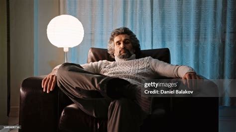 Man Watching Tv Late At Night On The Couch High-Res Stock Photo - Getty Images