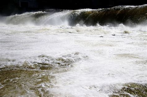 the water is rushing over the rocks and into the river to see what's going on