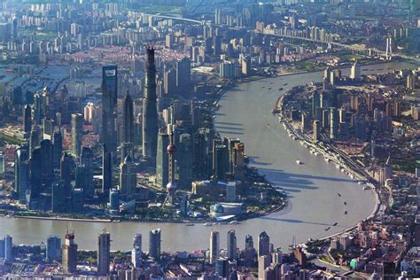 aerial view of lujiazui financial district in shanghai, with the three supertalls 421-632 m tall ...