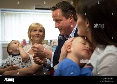 Prime Minister David Cameron meets parents with their children and staff at Stepping Stones ...