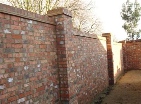 Brick wall with two brick piers and on-edge headers for coping | Brick wall gardens, Stone walls ...