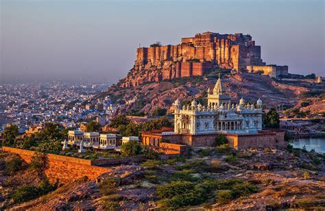 Sunrise at the Mehrangarh Fort and Jaswant Thada Mausoleum with the blue city in the background ...