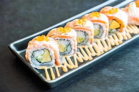 Salmon sushi roll, traditional Japanese food 2144576 Stock Photo at Vecteezy