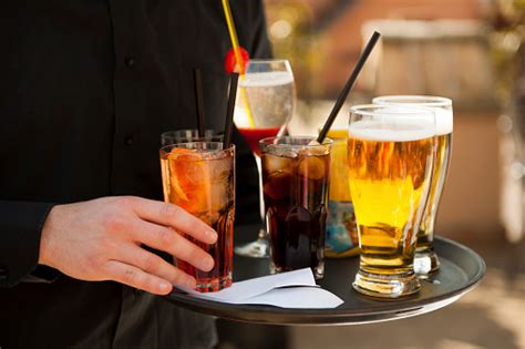 Waiter Serving Drinks On The Tray Stock Photo - Download Image Now - iStock