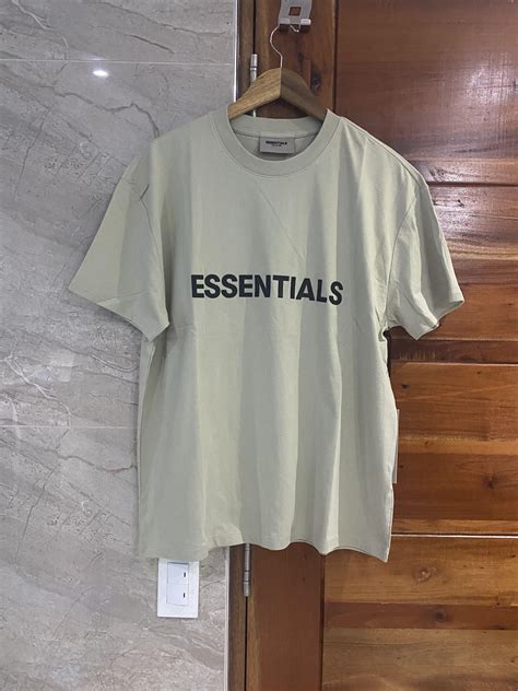 Fear of God Essentials T-shirt Sage, Men's Fashion, Tops & Sets, Tshirts & Polo Shirts on Carousell