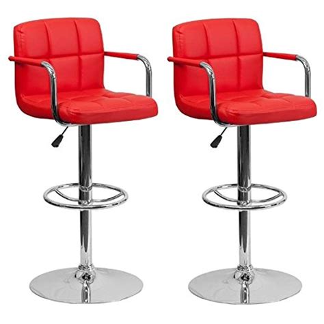 pair of red padded bar stools with chrome base