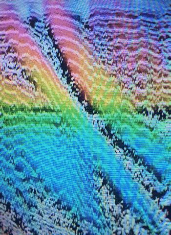 a tv screen with an image of colorful waves on it's display surface ...