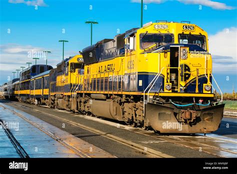 Blue and yellow train of the Alaska Railroad in Anchorage, ready for departure to Denali ...