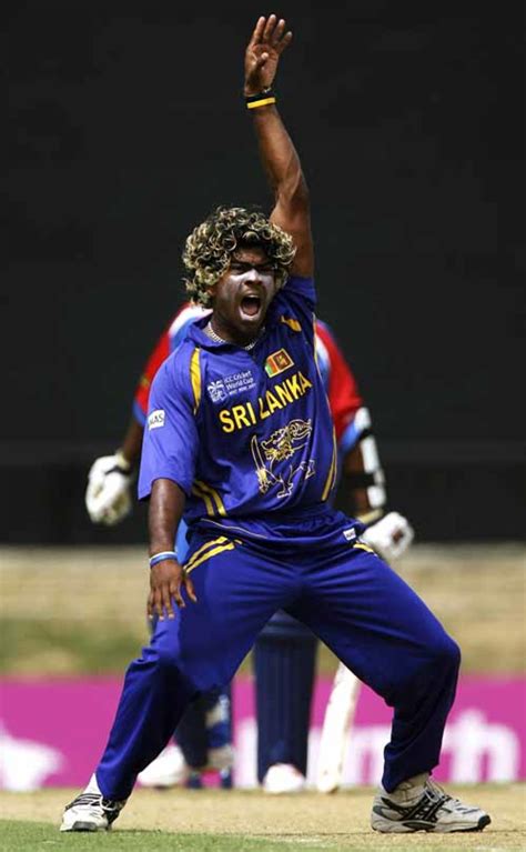 Lasith Malinga appeals successfully for the wicket of Irvine Romaine ...