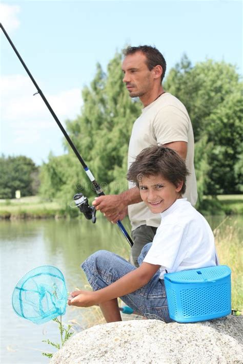 Father and son fishing stock image. Image of outdoors - 30473175