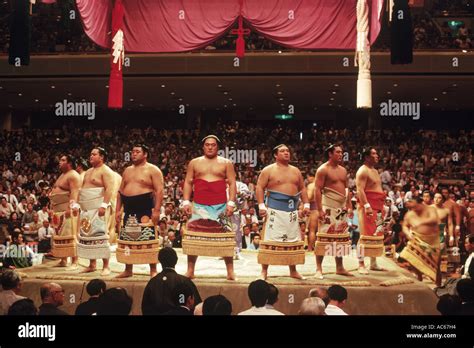 Pre fight sumo wrestling ceremony of competitors parading around ring ...