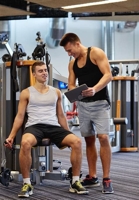 Men Exercising on Gym Machine Stock Photo - Image of equipment, mates ...