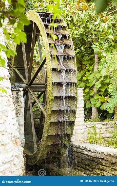 Wooden old mill wheel. stock photo. Image of tourism - 33616830