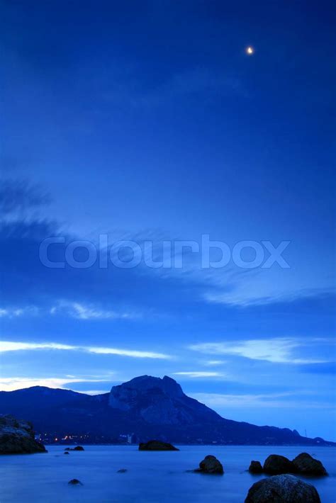 Moonrise over the ocean beach | Stock image | Colourbox