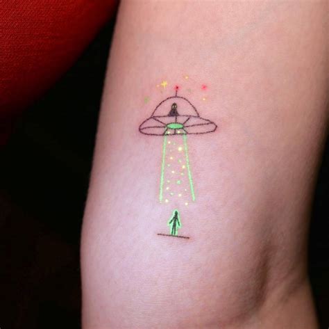 Hand poked UFO Tattoo done on the inner arm using UV