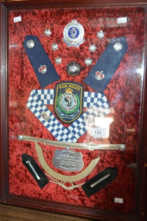 Framed collection of NSW Police officer's badges,