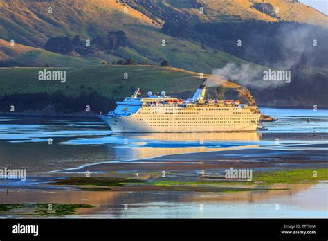 Cruise ship entering Port Chalmers at dawn Stock Photo - Alamy