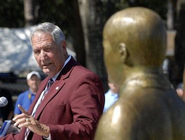 Statue of Gene Stallings, late son John Mark unveiled at Faulkner ...