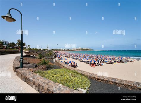 Promenade and beach Playa de las Cucharas, Costa Teguise, Lanzarote, Canary Islands, Spain Stock ...