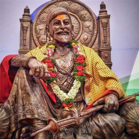 Download Shivaji Maharaj Statue Sitting With Hand On Knee Wallpaper | Wallpapers.com