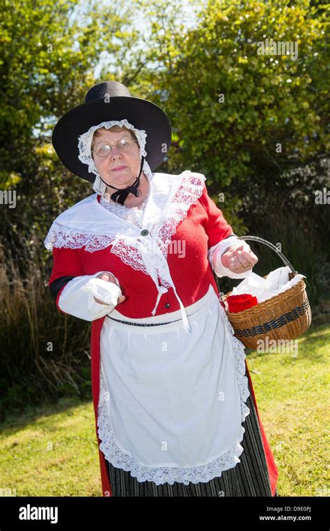 A woman dressed in traditional welsh costume selling old fashioned ...