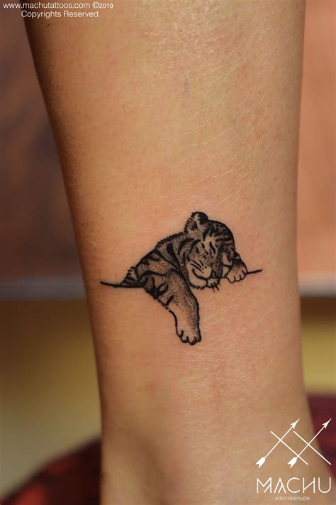 Minimalistic tiger tattoo | cute sleeping tiger tattoo | Tiger tattoo ...