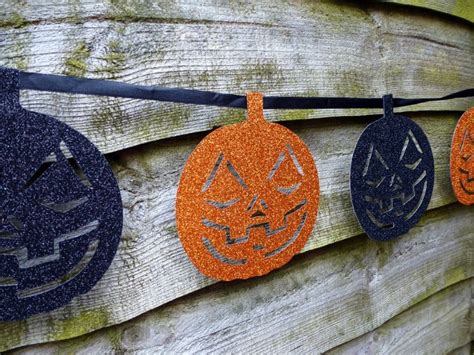 Image of Halloween decoration hanging on a rustic wood wall | CreepyHalloweenImages