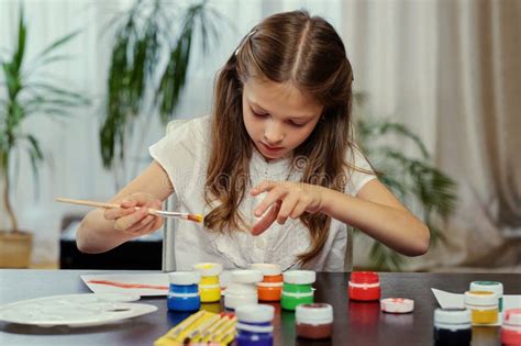 A Girl Painting with Acrylic Paint. Stock Image - Image of caucasian, female: 115132301