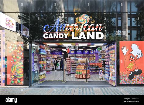 American Candy Land sweet shop, people and store exterior on Oxford Street, London, England ...