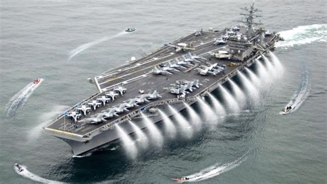 an aircraft carrier in the middle of the ocean