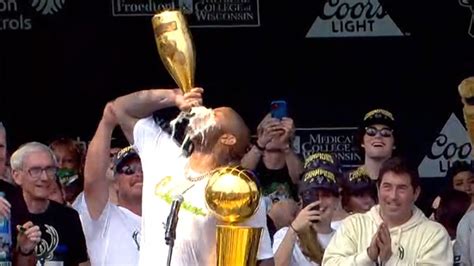 P.J. Tucker Chugs From Huge Champagne Bottle At Bucks' Championship Parade