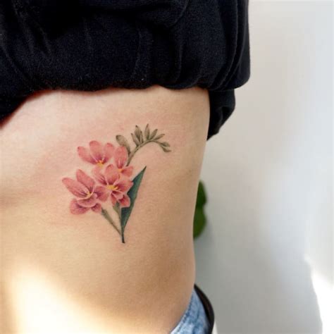 22 Beautiful and Delicate Freesia Tattoo Designs | TattooAdore