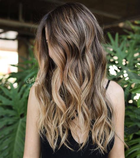 Warm brunette for the fall. Golden highlights adding dimension using baby lights for an easy ...