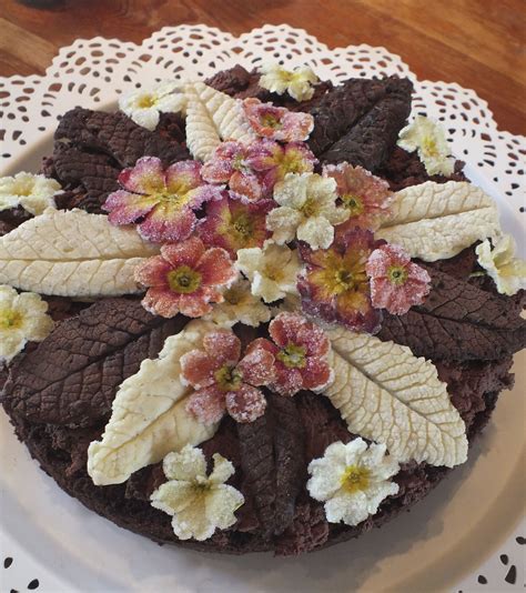 Crystallised primrose and primula edible flowers. Easter cake made at ...