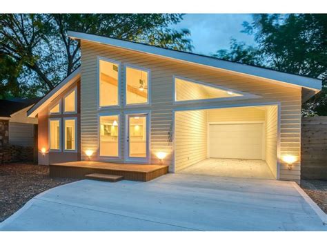 Dig this modern single-story with its pitched roof and recessed garage and carport. Shed Roof ...