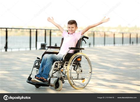 Happy Boy Wheelchair Outdoors — Stock Photo © serezniy #215194418