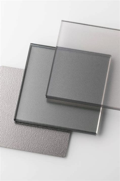 three different types of glass are shown on the table, one is gray and ...