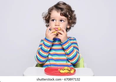 Kid Getting Messy While Eating Chocolate Stock Photo (Edit Now) 648707983