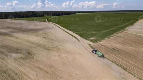 Tractor driven organic fertilizer on the field 5885477 Stock Photo at Vecteezy