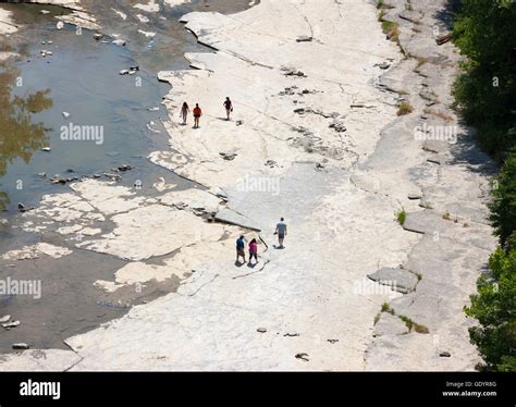 Family hiking the Gorge Trail in the Taughannock Falls State Park, NY ...